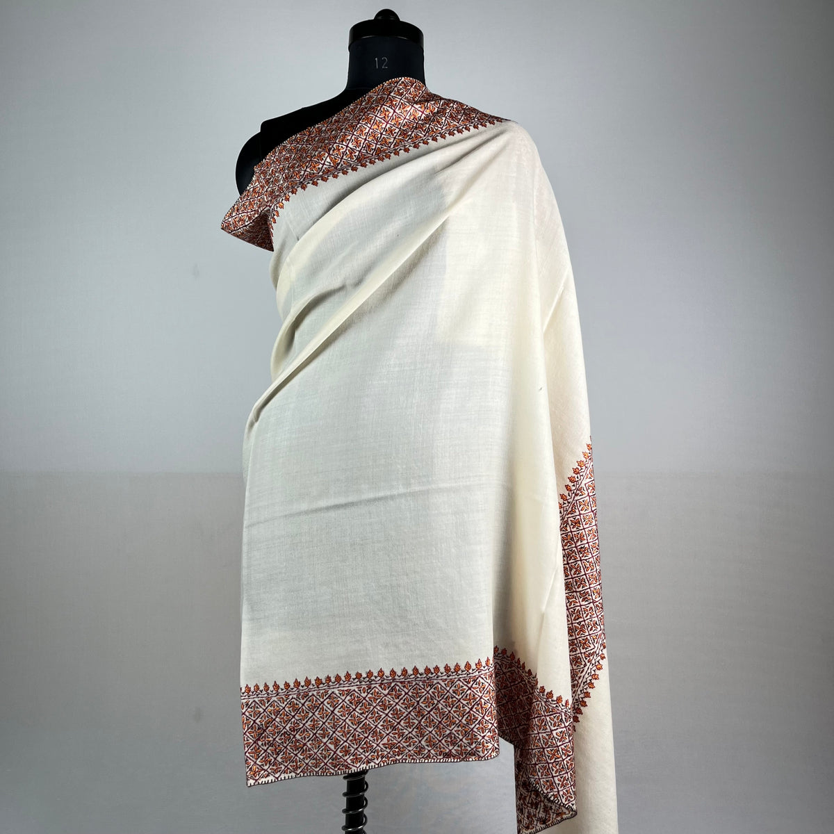 Close-up of Sozni needlework embroidery on white Pashmina shawl