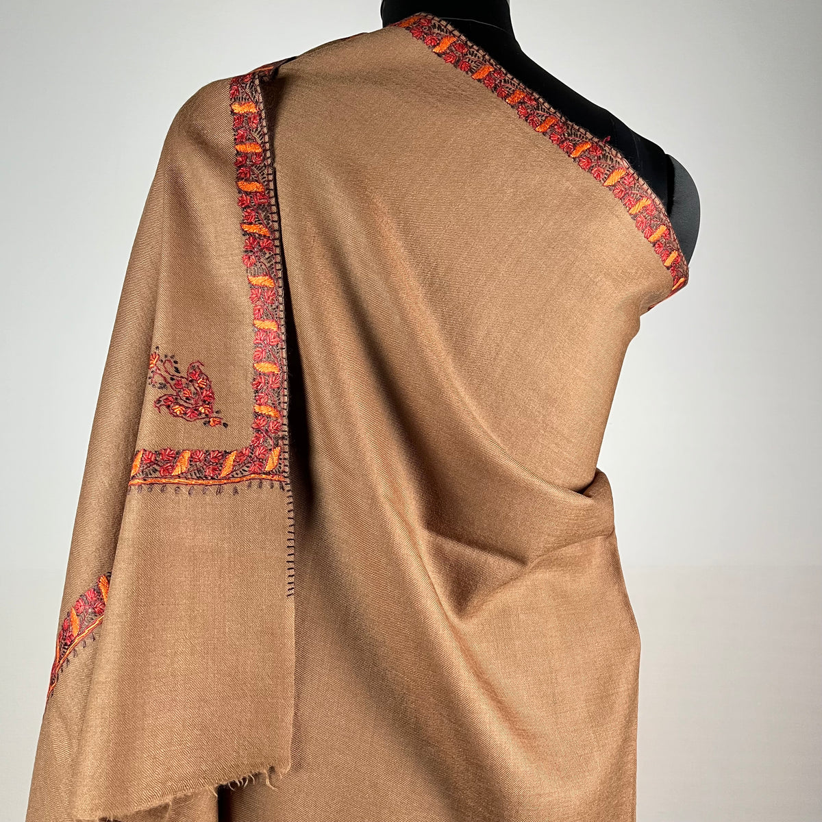 Close-up of Hashidar Sozni needlework on brown Pashmina shawl