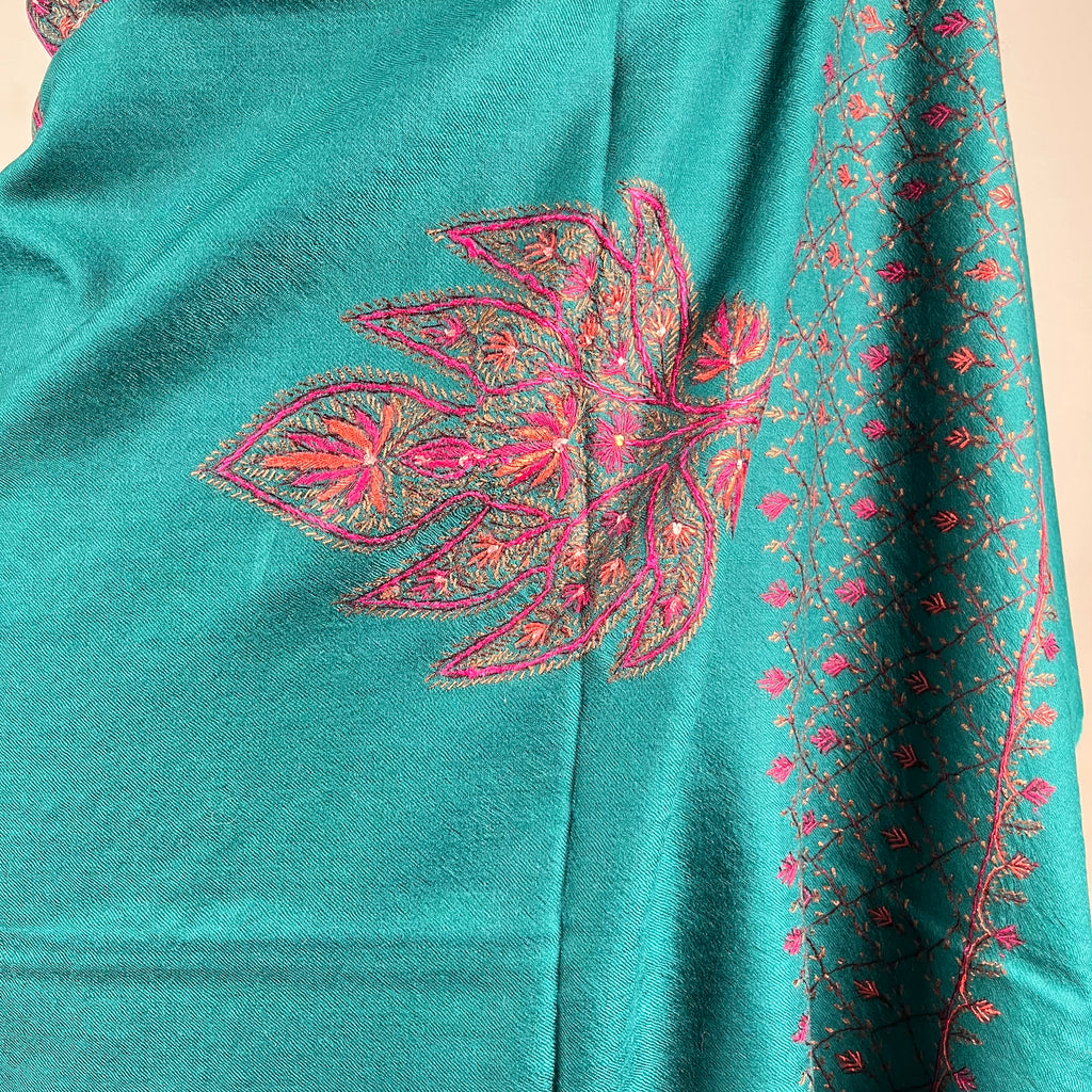 Detail of hand-stitched Sozni embroidery on blue Pashmina shawl