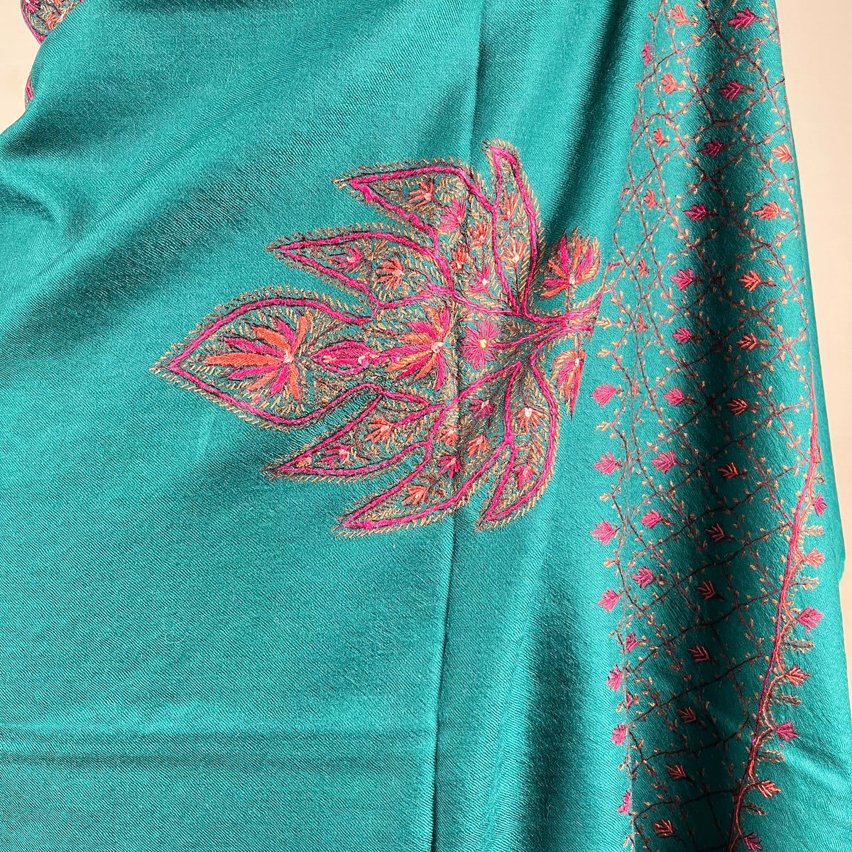 Detail of hand-stitched Sozni embroidery on blue Pashmina shawl