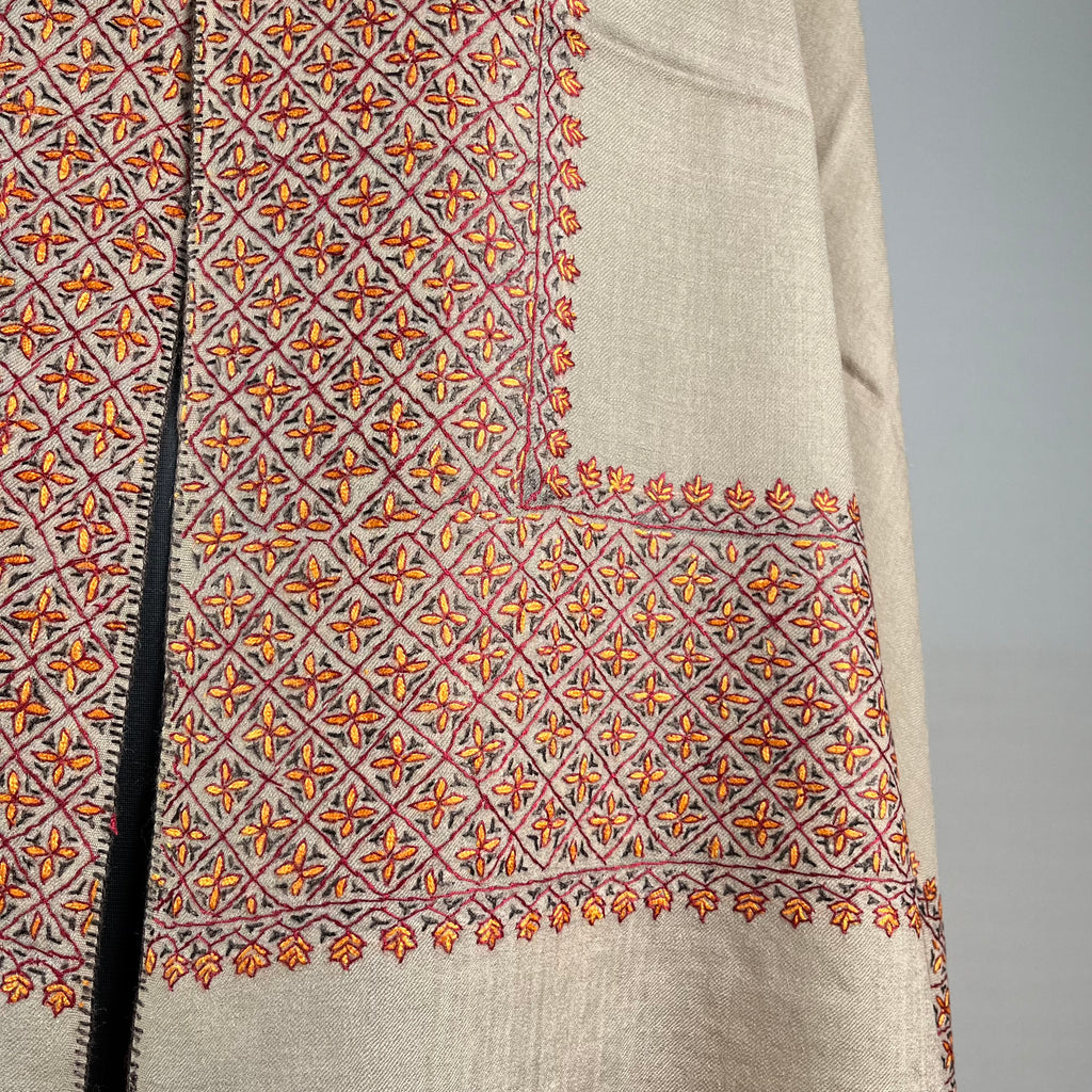 Detail of hand-stitched Sozni embroidery on light brown Pashmina shawl