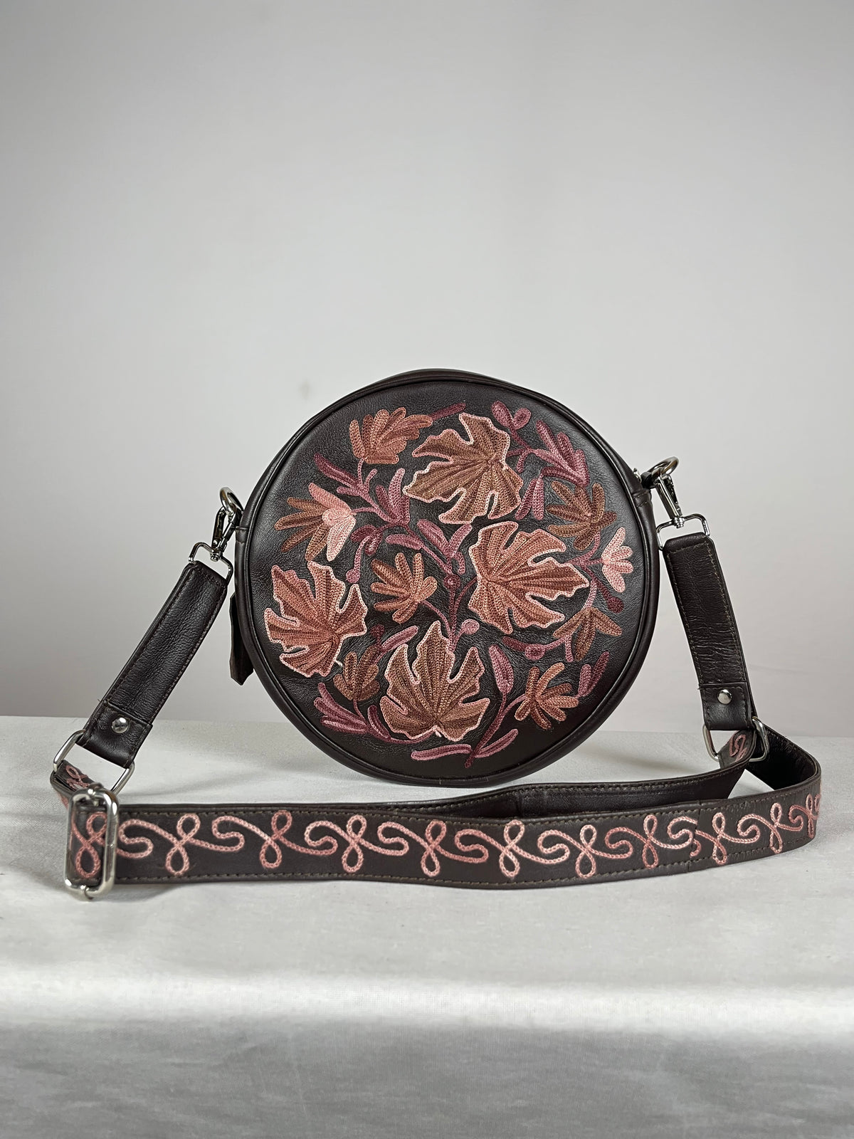 Inside view of brown sheep leather circle bag showing pockets